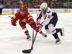Detroit Red Wings defenseman Mike Green (25) defends Washington Capitals center Brooks Laich (21) in the third period of an NHL hockey game Tuesday, Nov. 10, 2015, in Detroit. (AP Photo/Paul Sancya)