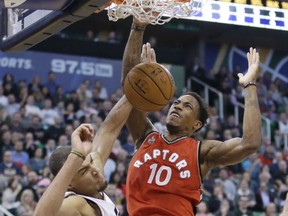 Toronto Raptors guard DeMar DeRozan (10) dunks the ball as Utah Jazz center Rudy Gobert, left, defends in the second half during an NBA basketball game, Wednesday, Nov. 18, 2015, in Salt Lake City. Utah won 93-89. (AP Photo/Rick Bowmer)