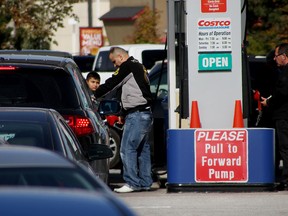 A motorist pumps gas in this file photo.