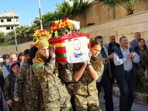 Brother soldiers parade the body of slain soldier John Gallagher in tribute through the streets of Syria. (Facebook Photo/Jesper Soder)