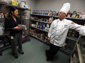 Health inspector Jennifer Lee (left) inspects the kitchen area of the St. Clair Centre for the Arts with executive chef Steven Meehan in Windsor on Thursday, November 5, 2015. (TYLER BROWNBRIDGE/The Windsor Star)