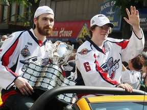 Harry Young, left, and Ryan Ellis carry the Memorial Cup during the Spitfires victory parade on Ouellette Avenue in Windsor on Monday, May 24, 2010. (TYLER BROWNBRIDGE/Windsor Star)