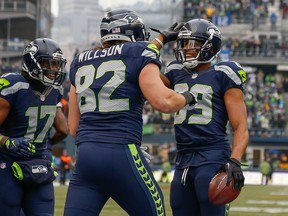 Wide receiver Doug Baldwin #89 of the Seattle Seahawks is congratulated by tight end Luke Willson #82 after scoring a touchdown in the second quarter against the Pittsburgh Steelers at CenturyLink Field on November 29, 2015 in Seattle, Washington. The Seahawks defeated the Steelers 39-30. (Photo by Otto Greule Jr/Getty Images)