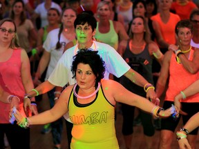 Katie Weir was front and centre making moves with about 100 other dancers during Zumba Glow party for Transition to Betterness held at Giovanni Caboto Club of Windsor Friday November 6, 2015.