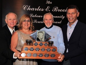 38th Charles E. Brooks Labour Community Service Award was presented to Theresa Farao by George Brooks, left, Hassan Yussuff, right, president of Canadian Labour Congress and Charles Brooks Jr. during Labour Appreciation Night at Giovanni Caboto Club of Windsor Friday November 20,2015. George Brooks and Charles Brooks Jr. are sons of Charles E. Brooks. Described as a dedicated and compassionate leader, Farao is president of Unifor Local 240. Friday night's dinner was sponsored by Windsor and District Labour Council and United Way Centraide Windsor-Essex County.