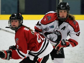 Southwest Wildcats Jenna Henry, right, follows the play against Nepean's Samantha Bouley, left, in first period action of Intermediate AA women's hockey from Forest Glade Arena Friday November 20, 2015. The game ended in a 1-1 tie. (NICK BRANCACCIO/Windsor Star)