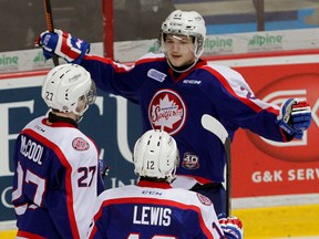 Windsor Spitfires Logan Brown celebrates his goal against Owen Sound with teammates Hayden McCool, left, and Jamie Lewis in OHL action at WFCU Centre Thursday February 5, 2015. (NICK BRANCACCIO/The Windsor Star)