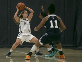 Windsor's Kaylee Anagnostopoulos, left, looks to pass while being defended by Toronto's Diedre Edwards and Abena Addo during OUA women's basketball between the Windsor Lancers and the visiting Toronto Varsity Blues at the St. Denis Centre, Saturday, Nov. 21, 2015.  (DAX MELMER/The Windsor Star)