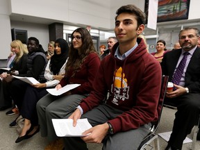 Catholic Central High School students Jonathan Nader, centre, Jessica Helou and Manal Muzammil, left, prepare to speak at the Windsor-Essex Catholic District School Board meeting on Nov. 24, 2015.