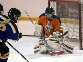 Sandwich Sabres goaltender Emily O'Bright makes a save during WECSSAA girls hockey action against the St. Anne Saints at the Vollmer Complex in LaSalle, Ontario on November 23, 2015. (JASON KRYK/WINDSOR STAR)