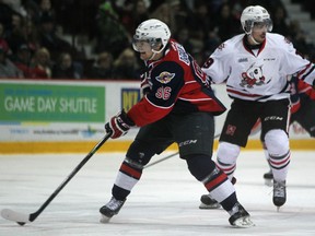 Windsor's Cristiano DiGiacinto, left, brings the puck up the ice followed by Niagara's Cody Payne in OHL action between the Windsor Spitfires and the Niagara Ice Dogs at the WFCU Centre, Sunday, Feb. 15, 2014.  (DAX MELMER/The Windsor Star)