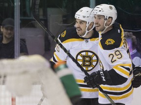 Boston Bruins Zac Rinaldo ( left) is congratulated by Landon Ferraro after scoring the Bruins' second goal on Toronto Maple Leafs goaltender James Reimer during first period NHL hockey action in Toronto on Monday, November 23, 2015. THE CANADIAN PRESS/Chris Young