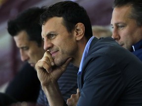 Windsor Spitfire head coach Rocky Thompson keeps an eye on the action from the fan seats during the team's blue and white game at the WFCU Arena on Thursday, Sept. 3, 2015,