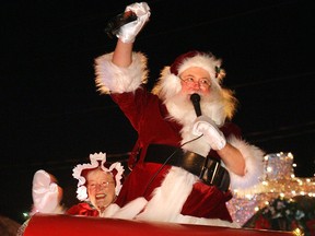 Santa and Mrs. Claus wave to the crowd from their sleigh as they take part in the annual Santa Claus Parade in Amherstburg in this file photo.