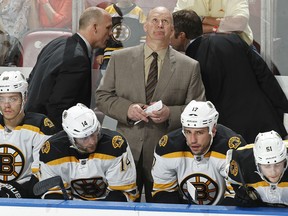 Head coach Claude Julien of the Boston Bruins looks at the scoreboard near the end of the third period against the Florida Panthers at the BB&T Center on April 9, 2015 in Sunrise, Florida. The Panthers defeated the Bruins 4-2. (Photo by Joel Auerbach/Getty Images)