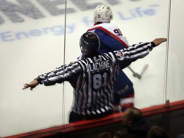 OHL linesman Ryan Lachine of Windsor makes a call in OHL game between Windsor Spitfires and Saginaw Spirit Nov. 27, 2015.  Lachine is calling it a career after 15 years and was honoured before the OHL game at WFCU Centre.