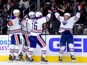 Taylor Hall #4 of the Edmonton Oilers celebrates his goal with his teammates to tie the game 3-3 with the Los Angeles Kings at Staples Center on November 14, 2015 in Los Angeles, California.  (Photo by Harry How/Getty Images)