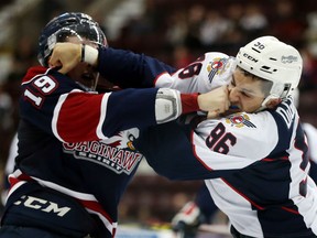 Saginaw Spirit winger Connor Brown fights Windsor Spitfires Cristiano DiGiacinto during third period Ontario Hockey League action at the WFCU Centre on October 1, 2015. (JASON KRYK/The Windsor Star)