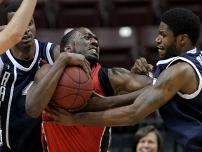 Windsor Express Chris Commons, centre, is fouled by Halifax Rainmen Nigel Spikes, left, and Jermaine Dailey in NBL Canada Game One of the league championship final at WFCU Centre Wednesday April 14, 2015. (NICK BRANCACCIO/The Windsor Star)