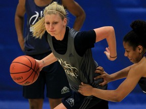 Lancers co-captain Caitlyn Longmuir, left, is guarded by Jahnae Gyles during practice Monday at the St. Denis Centre. (NICK BRANCACCIO/Windsor Star)