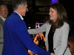 Windsor, Ontario. November 4, 2015.  Lancer women basketball ead coach Chantal Vallee, right, greets University of Windsor president Alan Wildeman and Richard Peddie, former head of Maple Leafs Sports during a pre-game ceremony where CIS national champion University of Windsor Lancers women basketball team received championship rings before game against Laurier Golden Hawks Wednesday November 4, 2015. (NICK BRANCACCIO/Windsor Star)