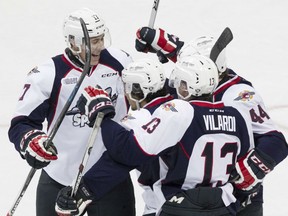 From left, Logan Stanley, Jalen Chatfield, Gabriel Vilardi, and Luke Kirwan celebrate after a Windsor goal in the first period of OHL action between the Windsor Spitfires and the visiting London Knights at the WFCU Centre, Sunday, Oct. 25, 2015.   (DAX MELMER/The Windsor Star)