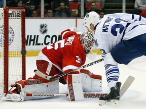 Detroit Red Wings goalie Jimmy Howard (35) stops a Toronto Maple Leafs center Shawn Matthias (23) shot in the first period of an NHL hockey game in Detroit Friday, Oct. 9, 2015. (AP Photo/Paul Sancya)