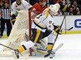 Nashville Predators defenseman Ryan Ellis (4) skates with the puck against the Detroit Red Wings during the second period of an NHL hockey game in Detroit, Saturday, Dec. 5, 2015.  (AP Photo/Jose Juarez)