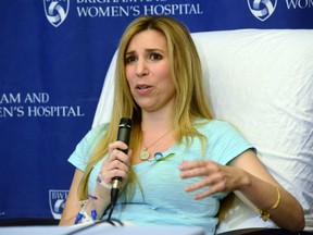 Boston Marathon bombing victim Heather Abbott of Newport. Rhode Island speaks to the media at Brigham and Women's Hospital April 25, 2013 in Boston, Massachusetts. Abbot had her left leg amputated several inches below the knee after because the injuries sustained after the blast.  (Photo by Darren McCollester/Getty Images)
