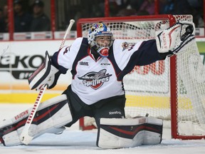 Windsor Spitfires goaltender Michael DiPietro reaches to make a second period save during Ontario Hockey League action against Saginaw in this file photo.