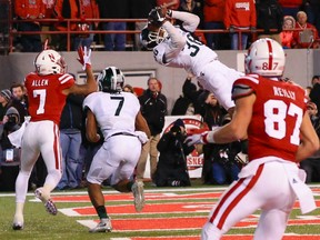 Windsor's Arjen Colquhoun (36) nearly intercepts a pass intended for Nebraska wide receiver Taariq Allen (7) with Michigan State defensive back Demetrious Cox (7) watching during the second half of an NCAA college football game in Lincoln, Neb., Saturday, Nov. 7, 2015. Nebraska won 39-38. (AP Photo/Nati Harnik)