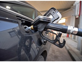 In this file photo, a car gets fuel at a gasoline station in Gelsenkirchen, Germany, Wednesday, Jan. 7, 2015.
