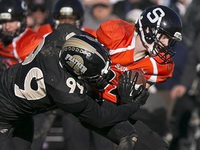 Windsor AKO Fratmen defensive end Adam Slikboer, at left, spent this past week with the CFL's Hamilton Tiger-Cats.