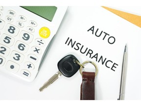 Auto insurance with car key and calculator. Image by fotolia.com.