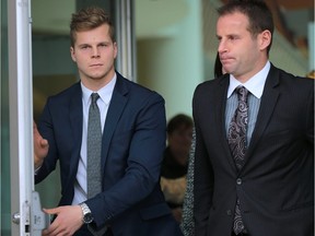 Ben Johnson (L) and his lawyer Evan Weber leave the Ontario Court on Thursday, November 12, 2015, after Johnson was found not guilty in a sexual assault case.