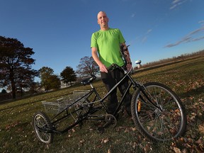 Mark Brown is photographed in Ruthven with a custom made bike he created for a 10 year-old boy in Windsor on Wednesday, November 4, 2015. Brown brought the bike to Windsor but has lost contact with the family.