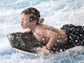 Gavin Langlois, 7, takes a ride on the WaveRider at Adventure Bay in this 2015 file photo.