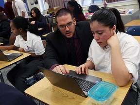 Const. Shawn Diotte helps students clean up their Facebook profiles during an anti-bullying event at Catholic Central in Windsor on Wednesday, Nov 18, 2015.