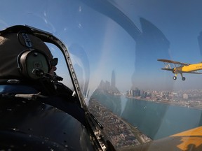 Members from The Canadian Historical Aircraft Association provided a ceremonial flyby for Remembrance Day ceremonies in Windsor, ON. on Wednesday, November 11, 2015. Pilot Victor Dominato cruises along side a 1941 Boeing Stearman during the flight.