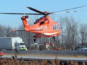 An Ornge helicopter takes off for hospital carrying an accident victim with serious injuries on Hwy. 401 near Tilbury today.