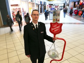 Perron S. Goodyear, Divisional Director of Emergency & Disaster Service, Public Relations & Development Representative, helps launch the 2015 Salvation Army Christmas Kettle Campaign, a fundraising effort that occurs each year during the Christmas season.