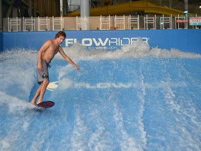 In this file photo, world-class surfer Eric Silverman tests the Flowrider at Adventure Bay Family Water Park on Thursday, Nov. 26, 2015.