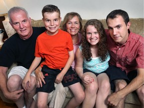 A Windsor family has raised $30,000 so they can buy eSight glasses to help three of their blind children see. Rod and Paula Rankin pose with their children Francis, 10, Tessa, 16, and Ian, 25, at their home on Thursday, August 13, 2015.