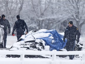 OPP investigate at the scene of fatal single motor vehicle accident on Concession Rd. 14, east of Pinkerton Rd. in Essex, Saturday, Nov. 21, 2015.