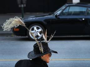 It was another fantastic day to take a stroll outside or get out in a sports car. Downtown fixture, feather-hat man Ron LaDouceur enjoys the sun Tuesday, Nov. 3, 2015, as a Porsche is parked nearby on Ouellette Ave.