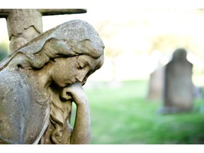 Female sculpture in cemetery. Photo by fotolia.com.