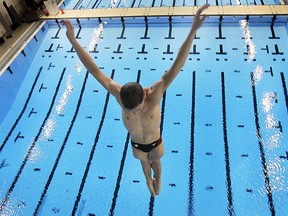 Vincent Riendeau of Montreal dives off the 10 metre tower at the Windsor Aquatic Centre during warm ups for the FINA/NVC World Diving Series in this 2014 file photo.