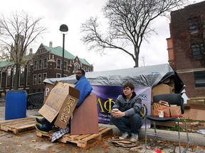 Members of the University of Windsor fraternity Pi Lambda Phi were raising awareness on the issue of homelessness on Friday, Nov. 6, 2015. They were camping in a homemade shelter on campus for three days and two nights in the elements to experience homelessness all while canvassing for money and canned goods for the needy. Kanathishan Suntharalingam, left, and Dylan Bull are shown in front of the shelter.