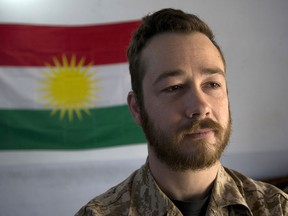 Former Canadian Forces member John Gallagher 31, stands at a Peshmerga army base near Kirkuk, Iraq on Thursday May 14, 2015.