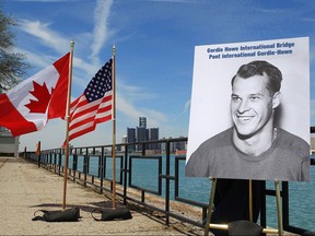 A photograph of Gordie Howe is displayed on the riverfront after a news conference, Thursday, May 14, 2015, in Windsor, Ontario, announcing that a planned bridge connecting Detroit, rear, and Windsor, will be named after the hockey Hall of Famer.
